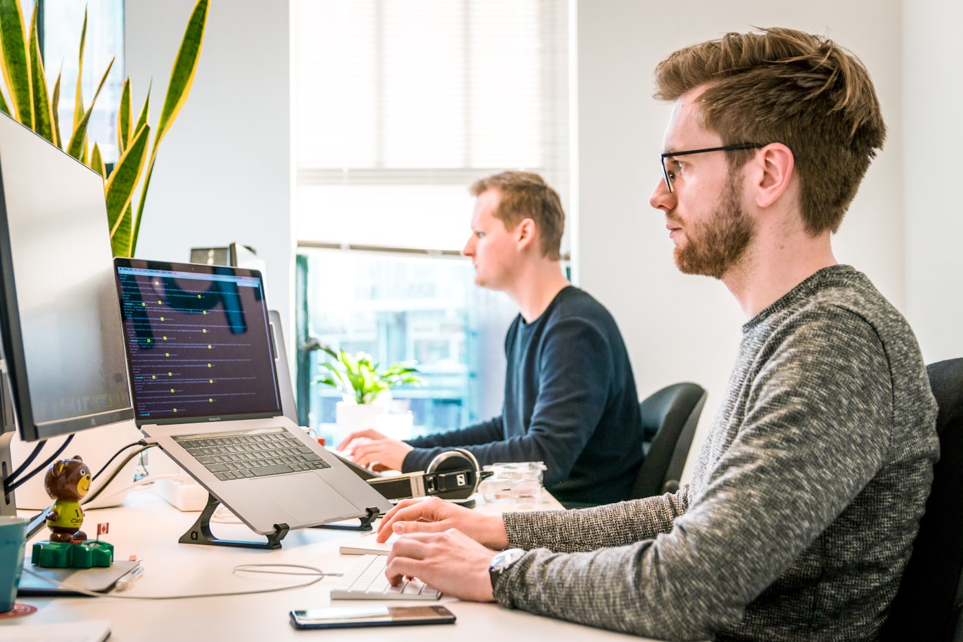 Software development team reviewing quality assurance processes